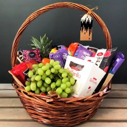 Basket with fruits and sweets