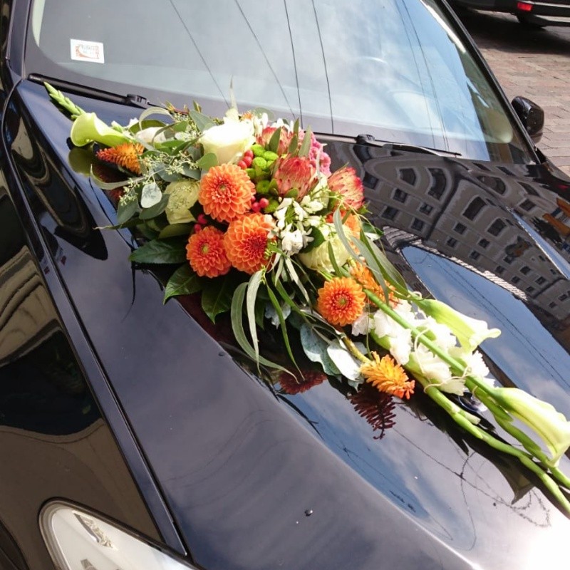 Wedding car decor with orange flowers